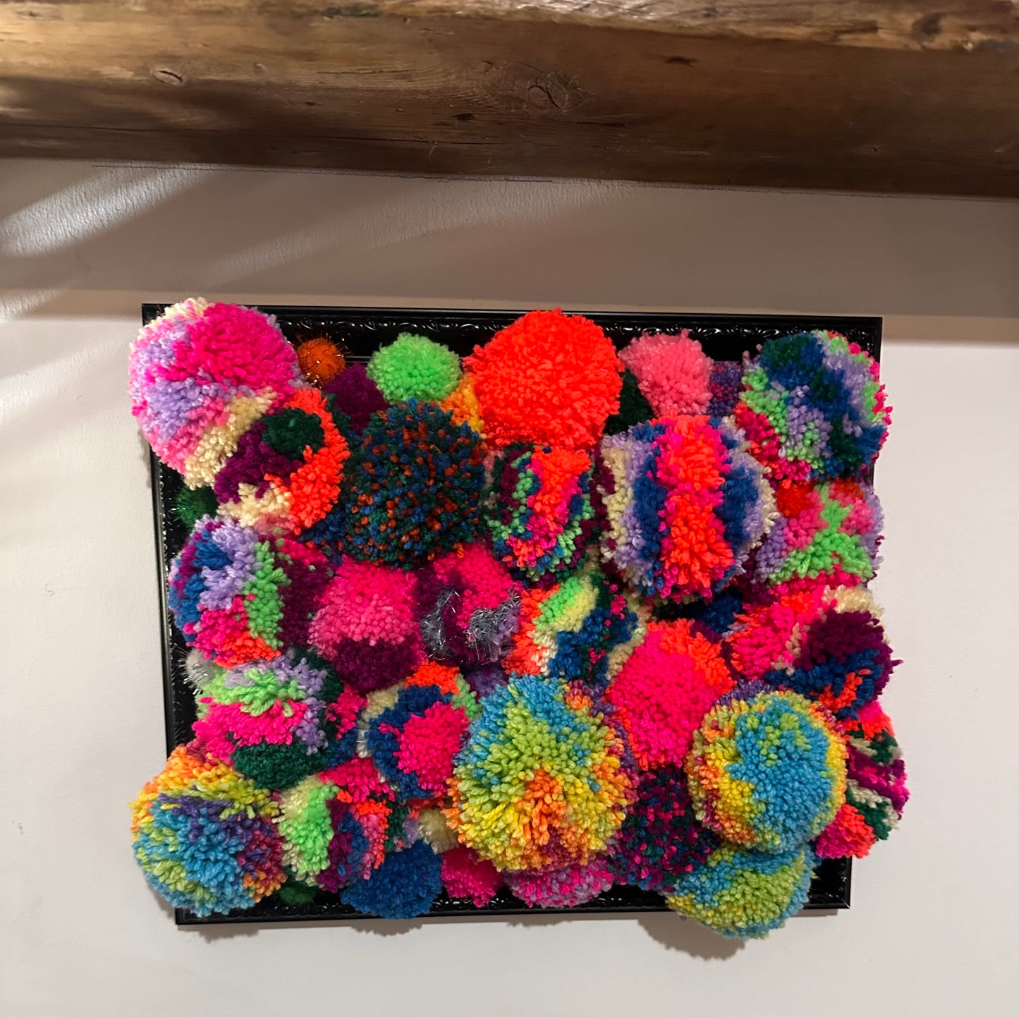 Pom Poms in a frame