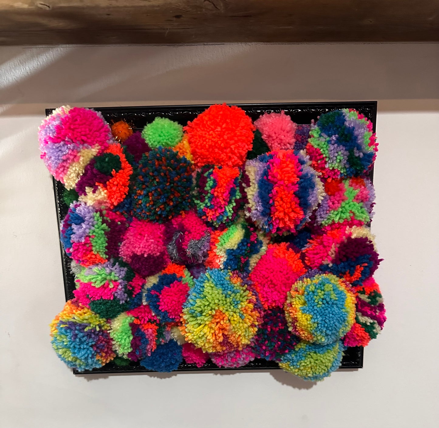 Pom Poms in a frame