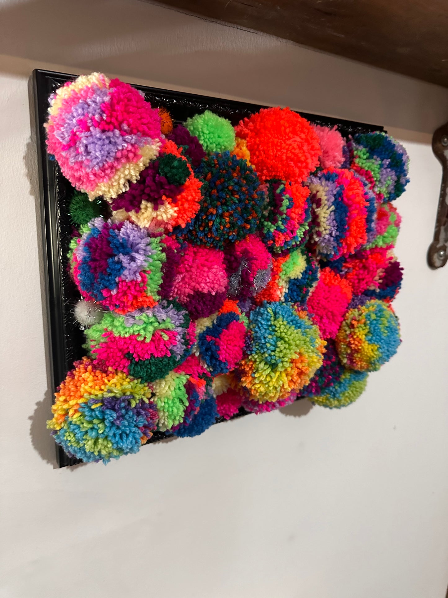 Pom Poms in a frame