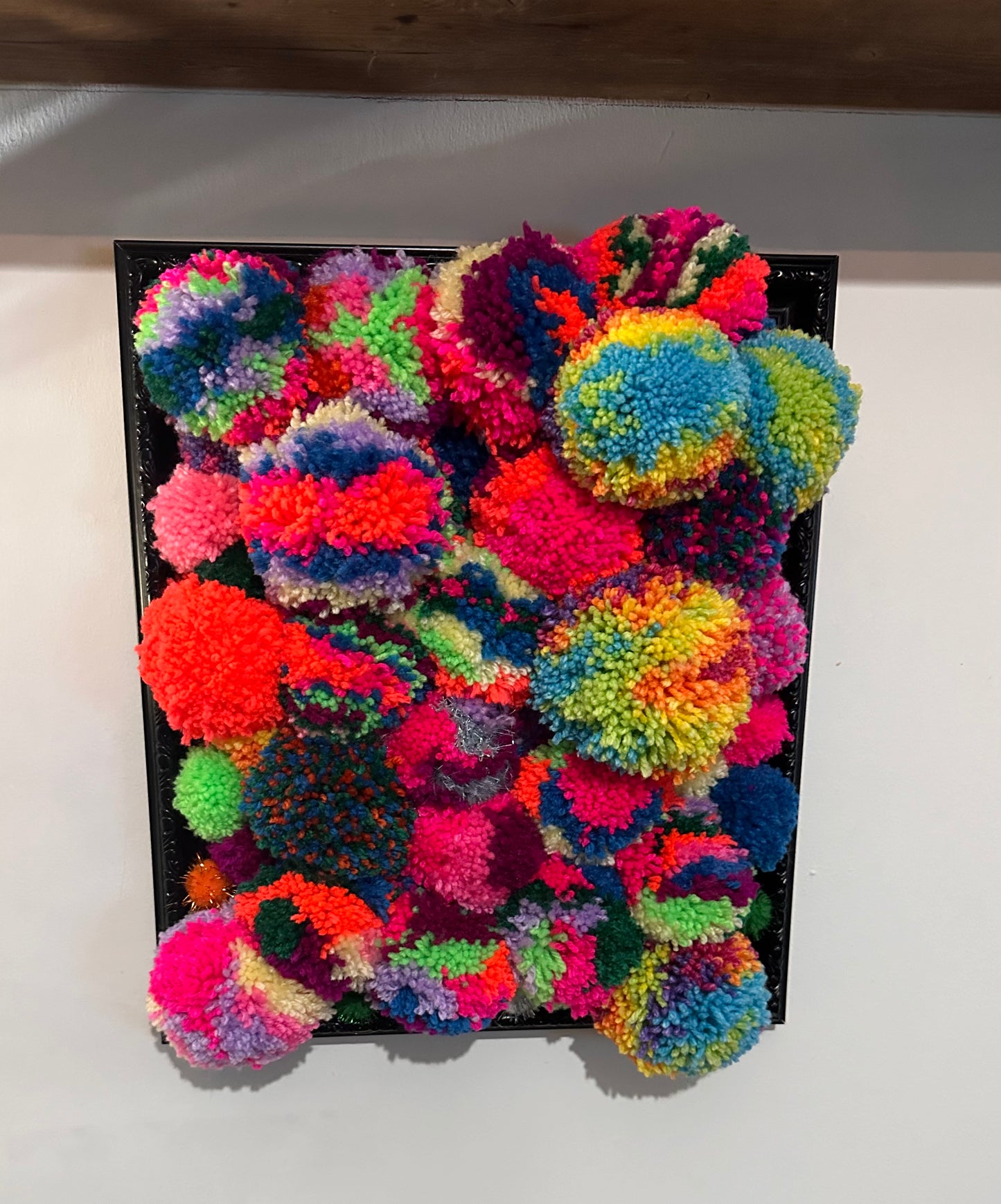 Pom Poms in a frame