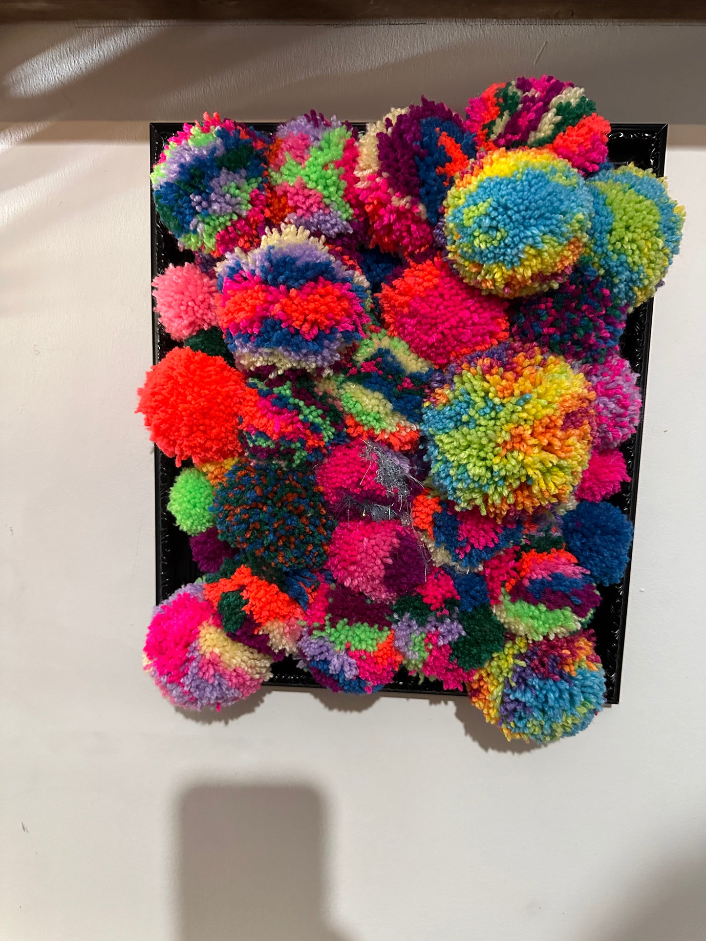 Pom Poms in a frame